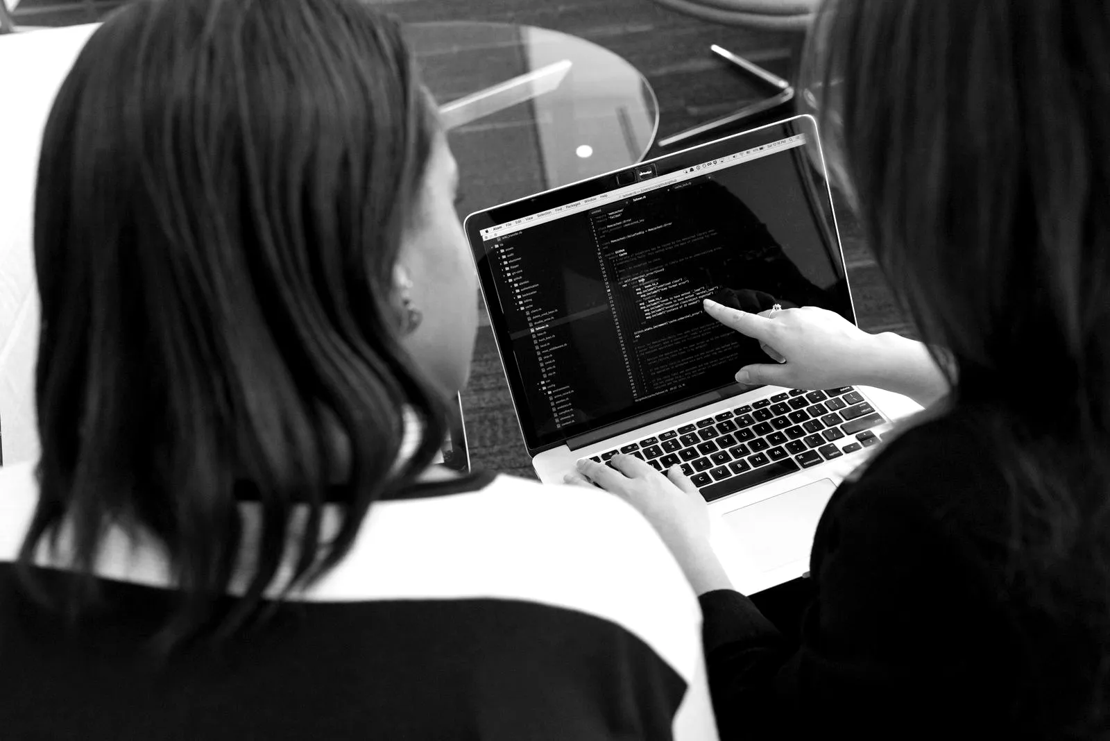 Two engineers reviewing code together